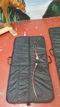 Load image into Gallery viewer, Midwater Bow Bag lay on the floor open with bow laid inside for size comparison