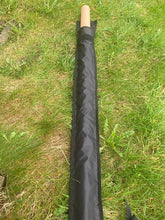 Load image into Gallery viewer, Midwater Pole Sleeve on the grass with cardboard tube demonstrating the opening